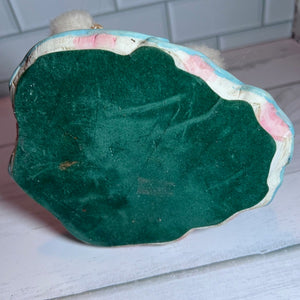 bottom of figurine