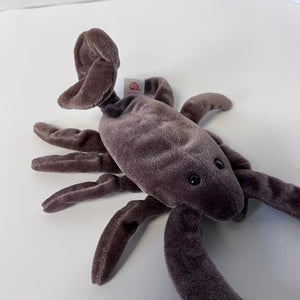 Plush toy scorpion on a white background