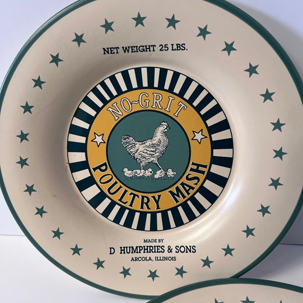 Decorative plate with 'No-Grit Poultry Mash' branding and star patterns.