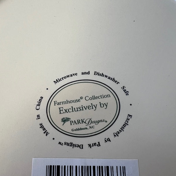 Label on a ceramic plate with 'Farmhouse Collection' and 'PARK Designs' branding.