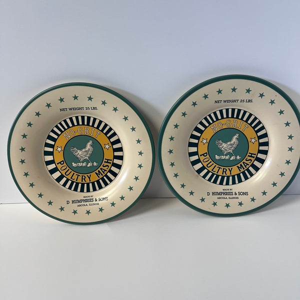 Two round plates with vintage poultry mash design on a white background