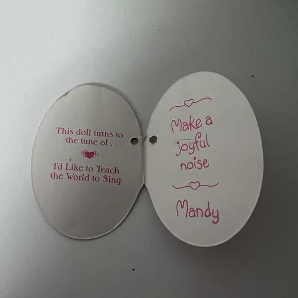 Two white oval tags with pink text on a gray background