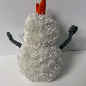 Small snowman plush toy with a white body, orange hat, and black arms on a white background