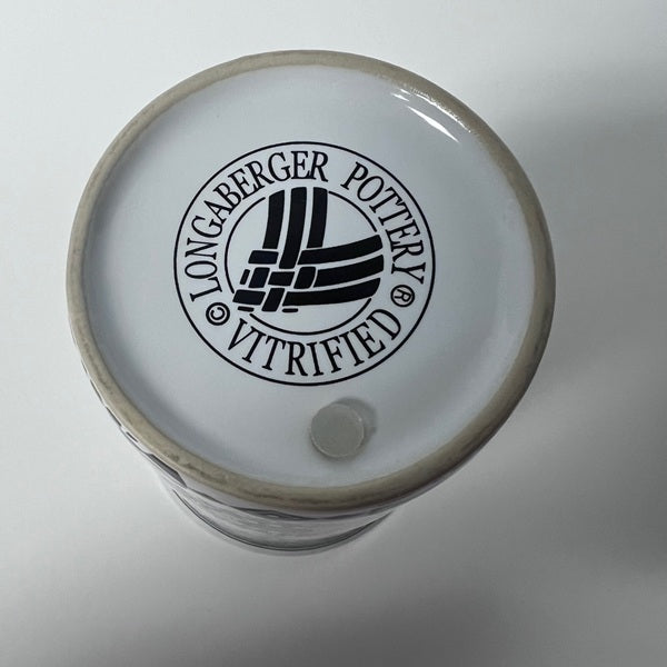 Ceramic container with 'Longaberger Pottery' logo on a white background