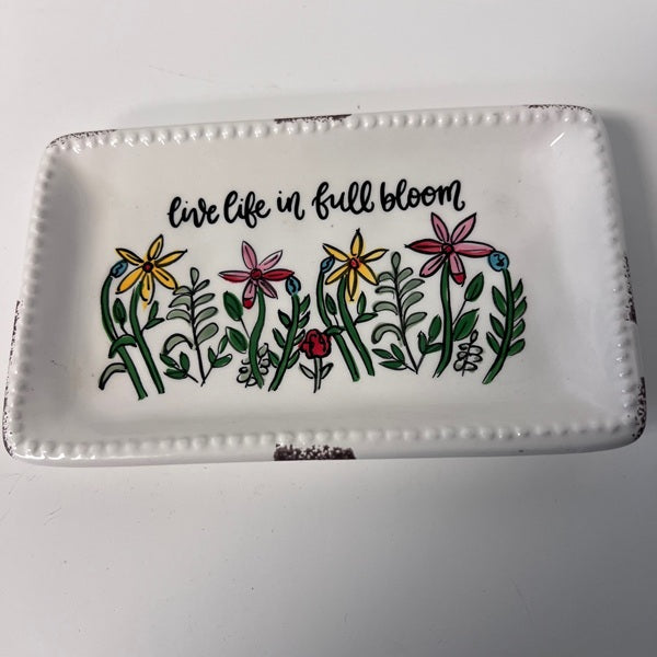 Decorative tray with floral design and 'live life in full bloom' text on a white background