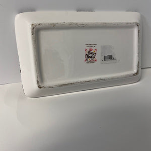 Rectangular white ceramic tray with a brand label on a gray background