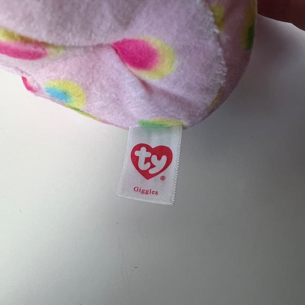 Ty Giggles plush toy with colorful polka dot pattern and visible tag on a white background