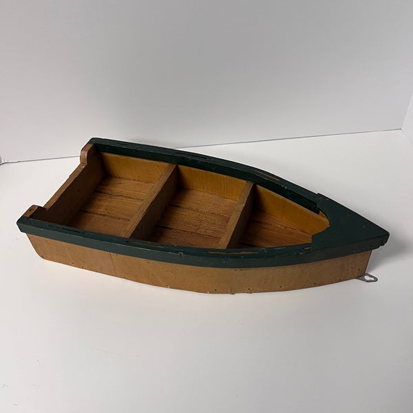 Wooden boat model on a white background