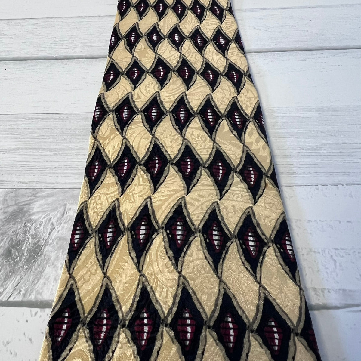 Patterned tie on a wooden surface