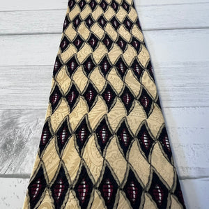 Patterned tie on a wooden surface