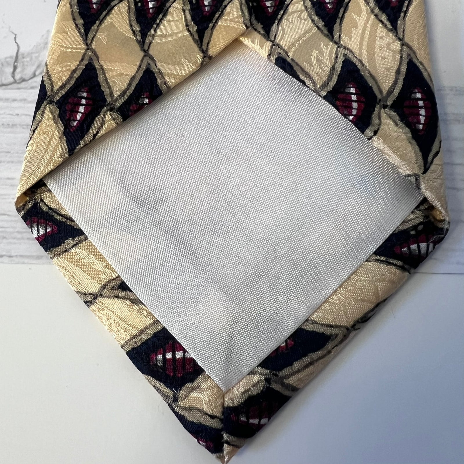 Fabric swatch with geometric pattern on a plain background