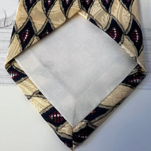 Fabric swatch with geometric pattern on a plain background