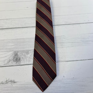 Striped tie on a light wooden surface