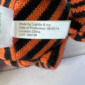 Knitted fabric with a label indicating 'Made by: Lambs & Ivy' and production details.