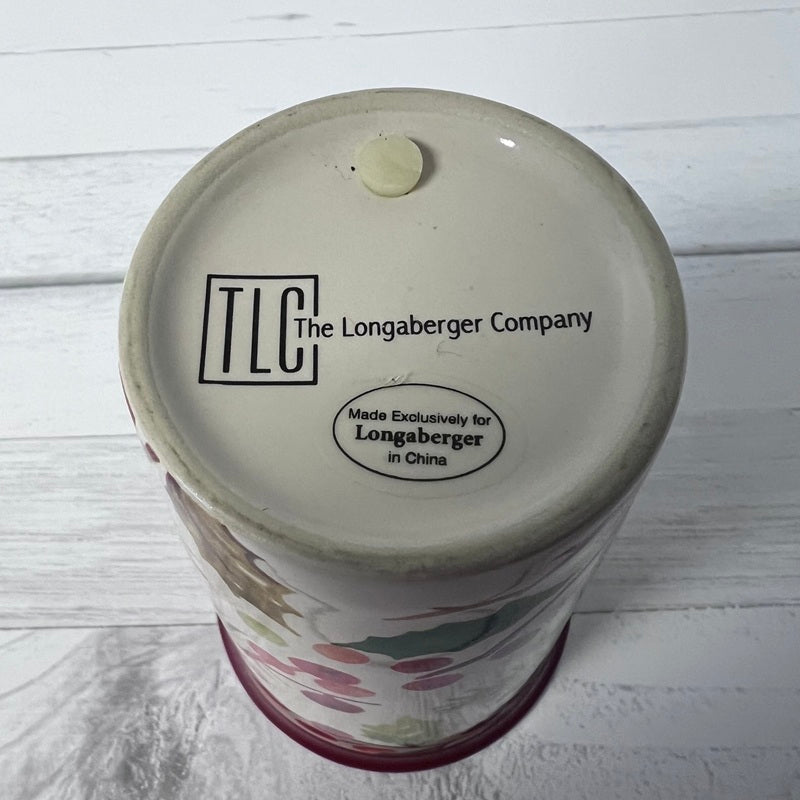 Bottom view of a Longaberger Company product with branding on a wooden surface