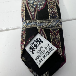Patterned silk tie with a label on a white background