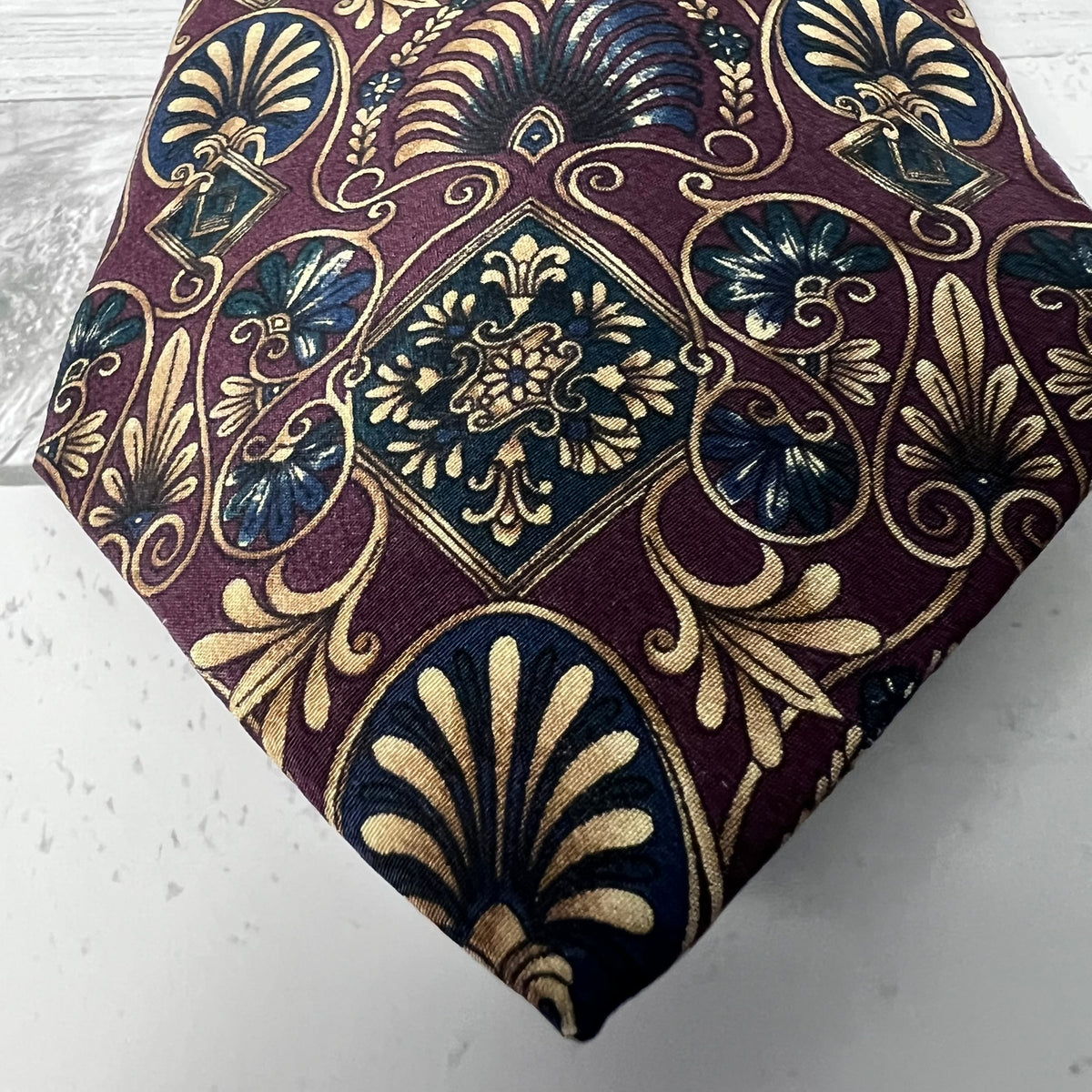 Decorative fabric with intricate patterns on a white surface