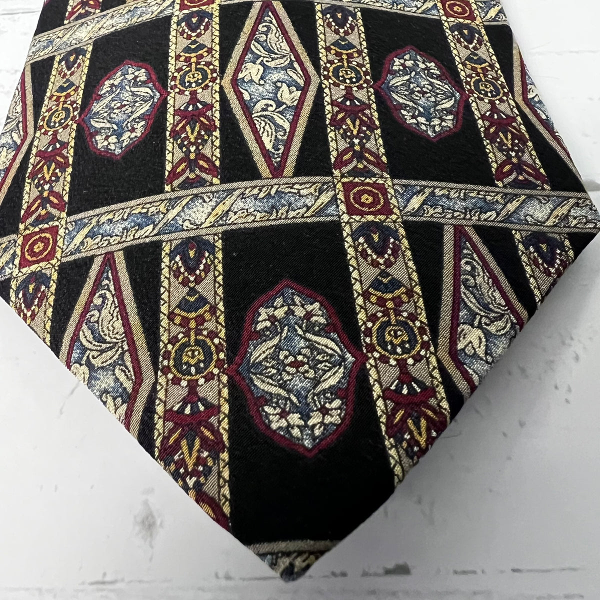 Decorative pillow with geometric pattern on a white surface