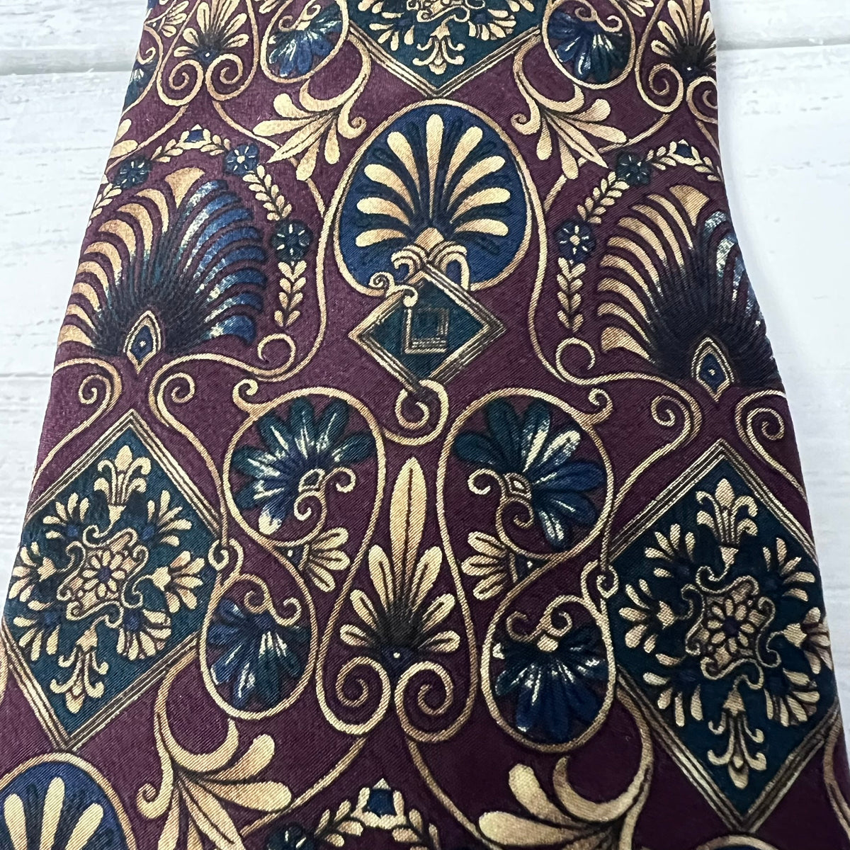 Decorative fabric with intricate patterns on a white background