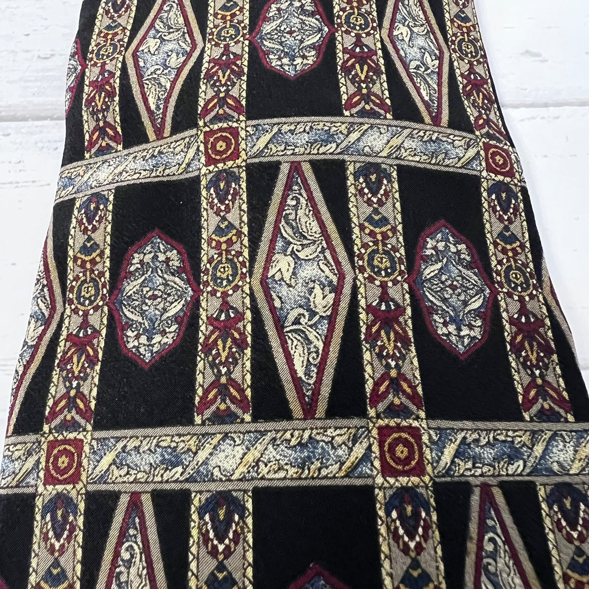 Decorative fabric with intricate patterns on a black background