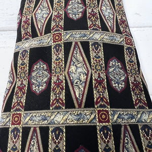 Decorative fabric with intricate patterns on a black background
