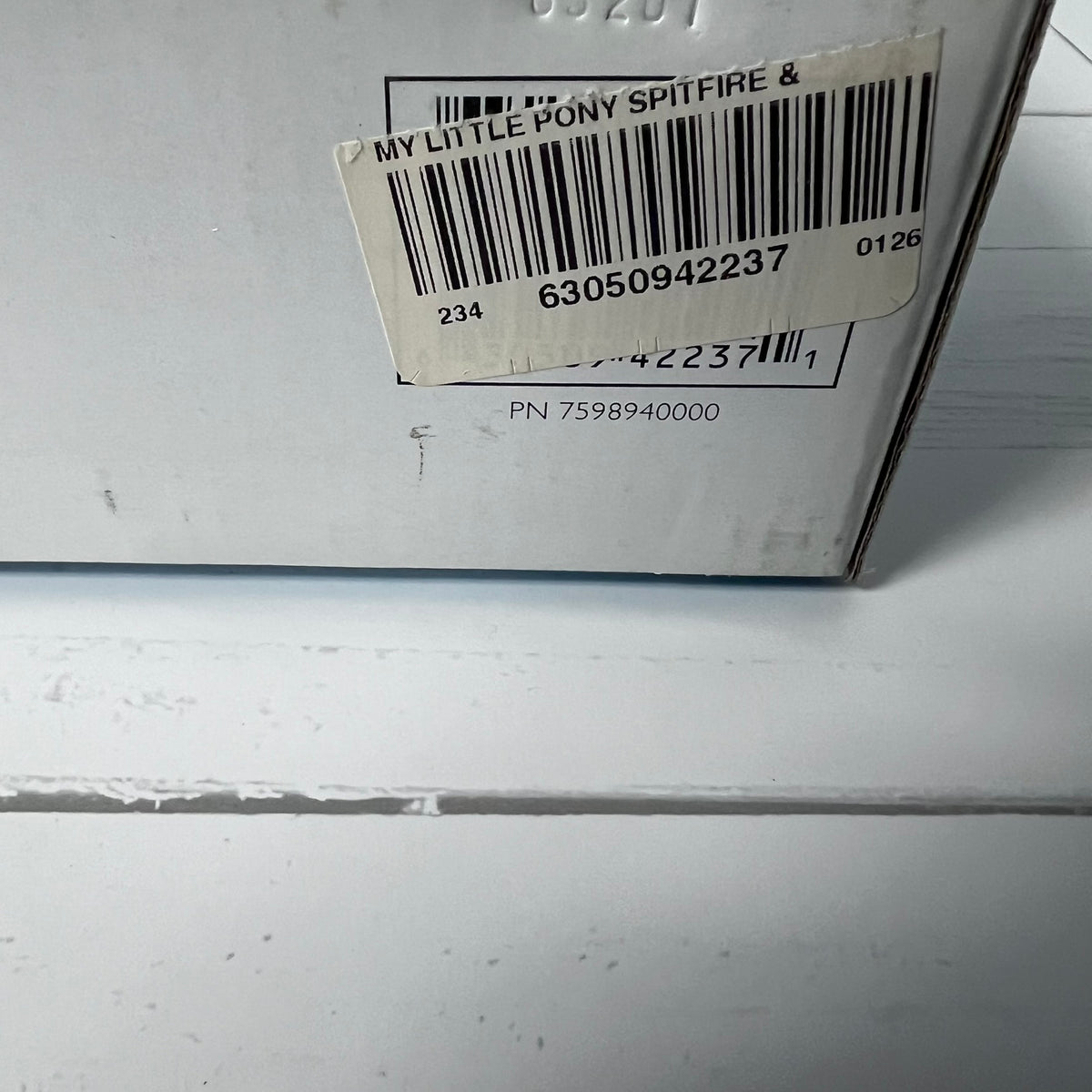 Barcodes on a product packaging with 'My Little Pony Spitfire' text.