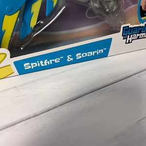 Toy packaging with 'Spitfire & Soarin'' branding on a wooden surface