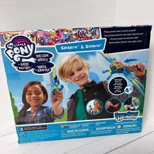 My Little Pony toy packaging with children holding ponies on a white background