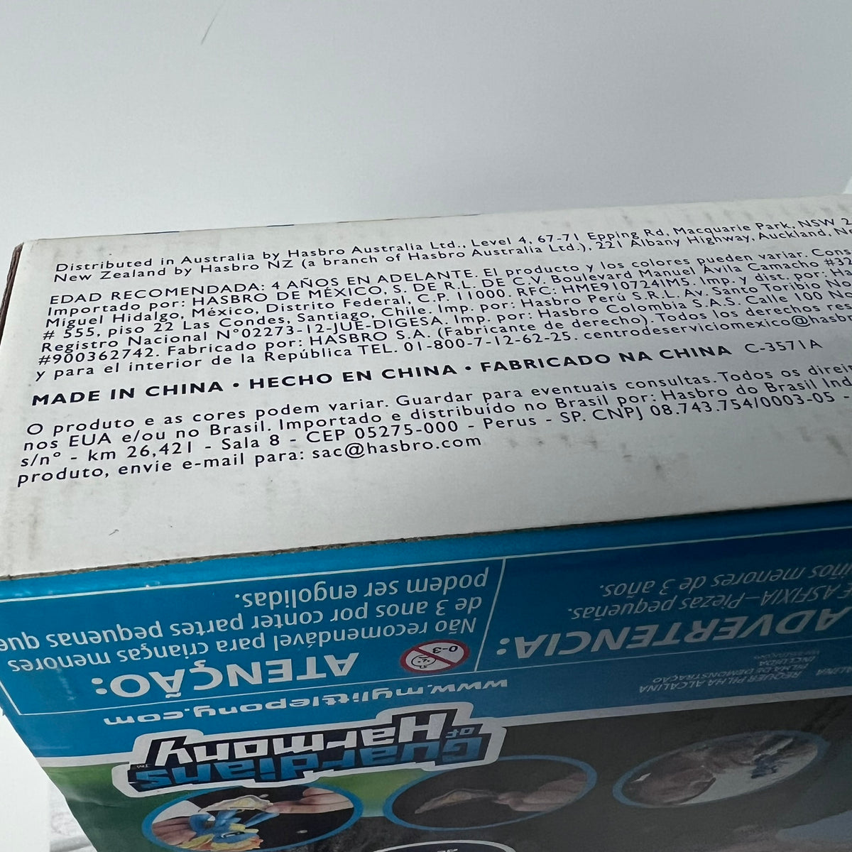 Close-up of a toy box with text and branding on a white background