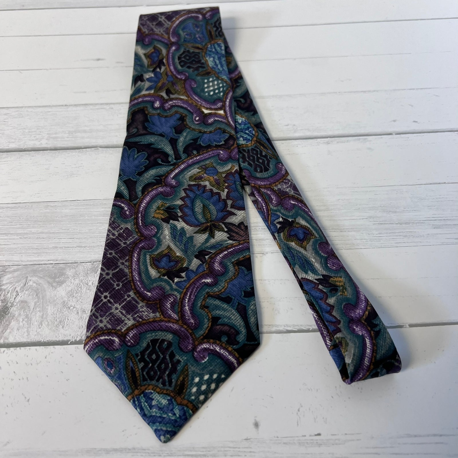 Patterned tie on a light wooden surface
