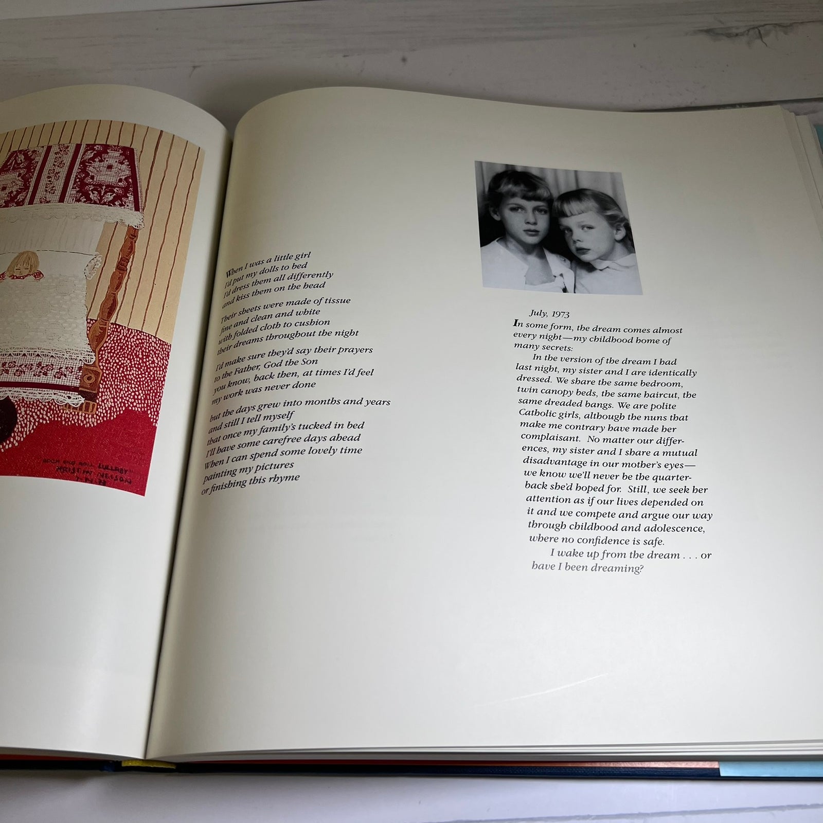 An open book spread showing printed text, a red illustration on the left page, and a black-and-white portrait photo on the right page, photographed against a light background.