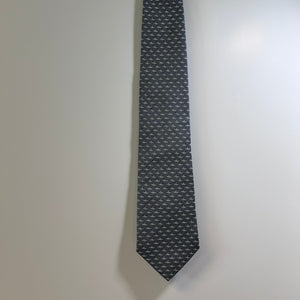 Black patterned tie on a light gray background