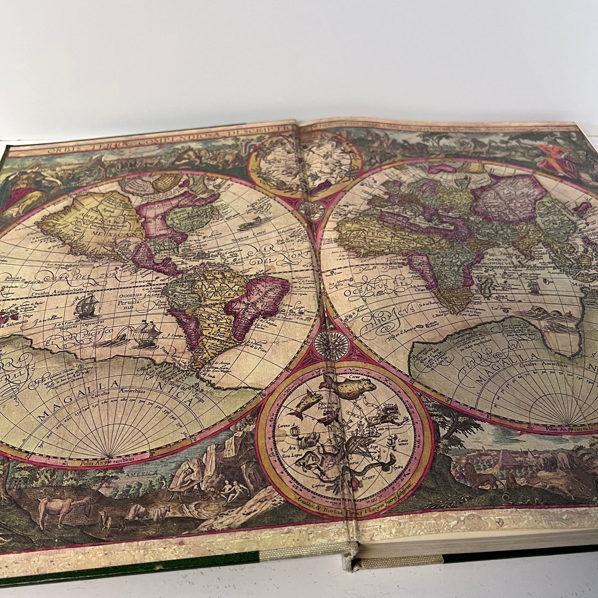 Open book with a detailed world map on a white background