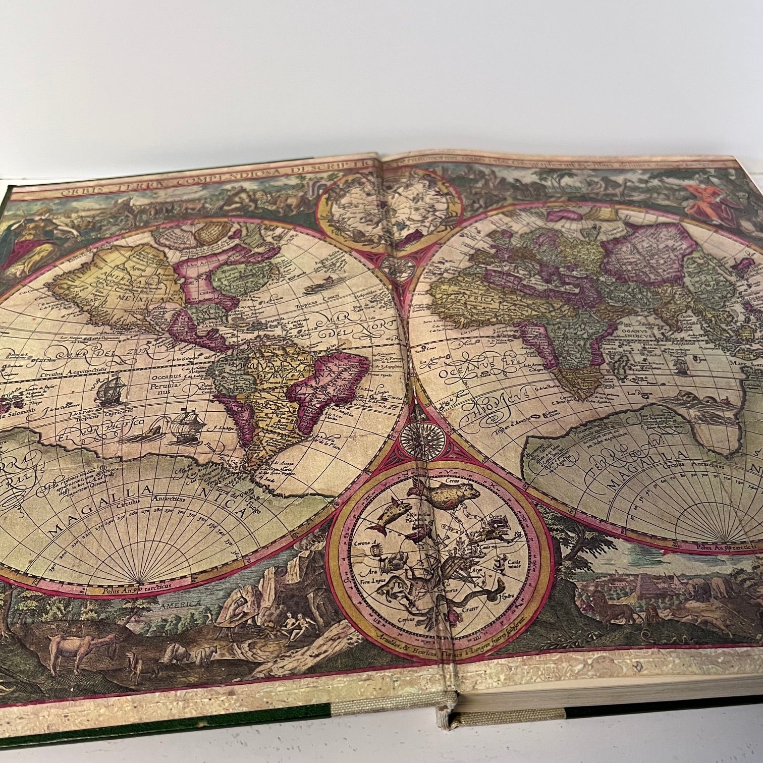 Open book with a detailed world map on a white background