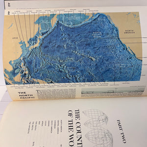 Map of the North Pacific on an open book