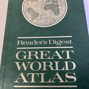 Book titled 'Great World Atlas' by Reader's Digest on a green background
