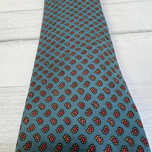Patterned tie on a light wooden surface