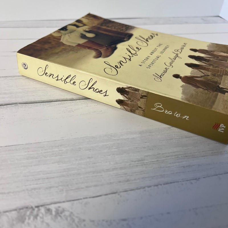 Book titled 'Sensible Shoes' on a wooden surface