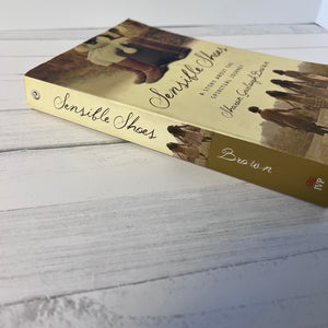 Book titled 'Sensible Shoes' on a wooden surface