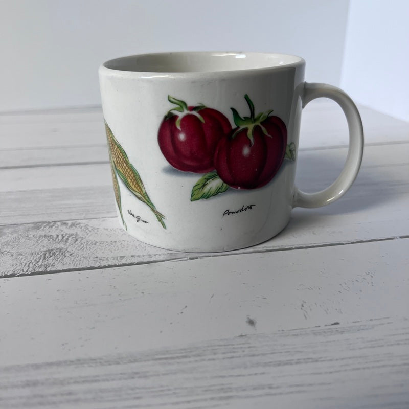 White mug with red radish design on a wooden surface