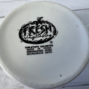 White plate with 'Fresh Vegetables' branding and safety information on a light wooden surface.