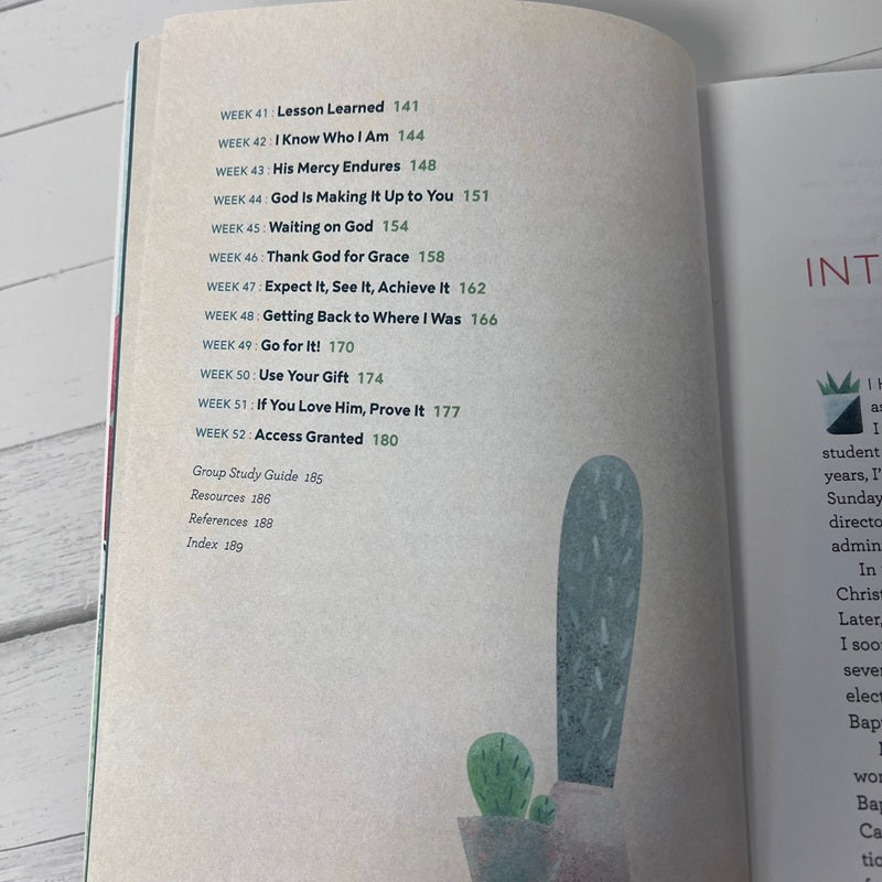Open book with a table of contents on a wooden surface