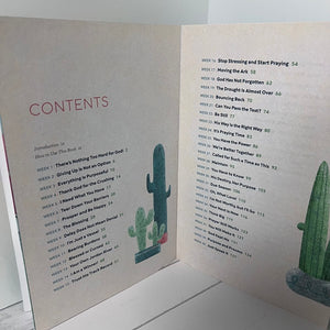 Open book with a cactus illustration on a white background