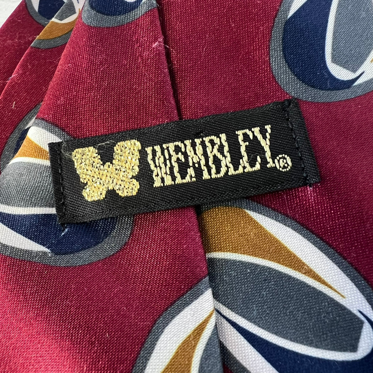 Close-up of a patterned fabric with a 'Wembley' label.