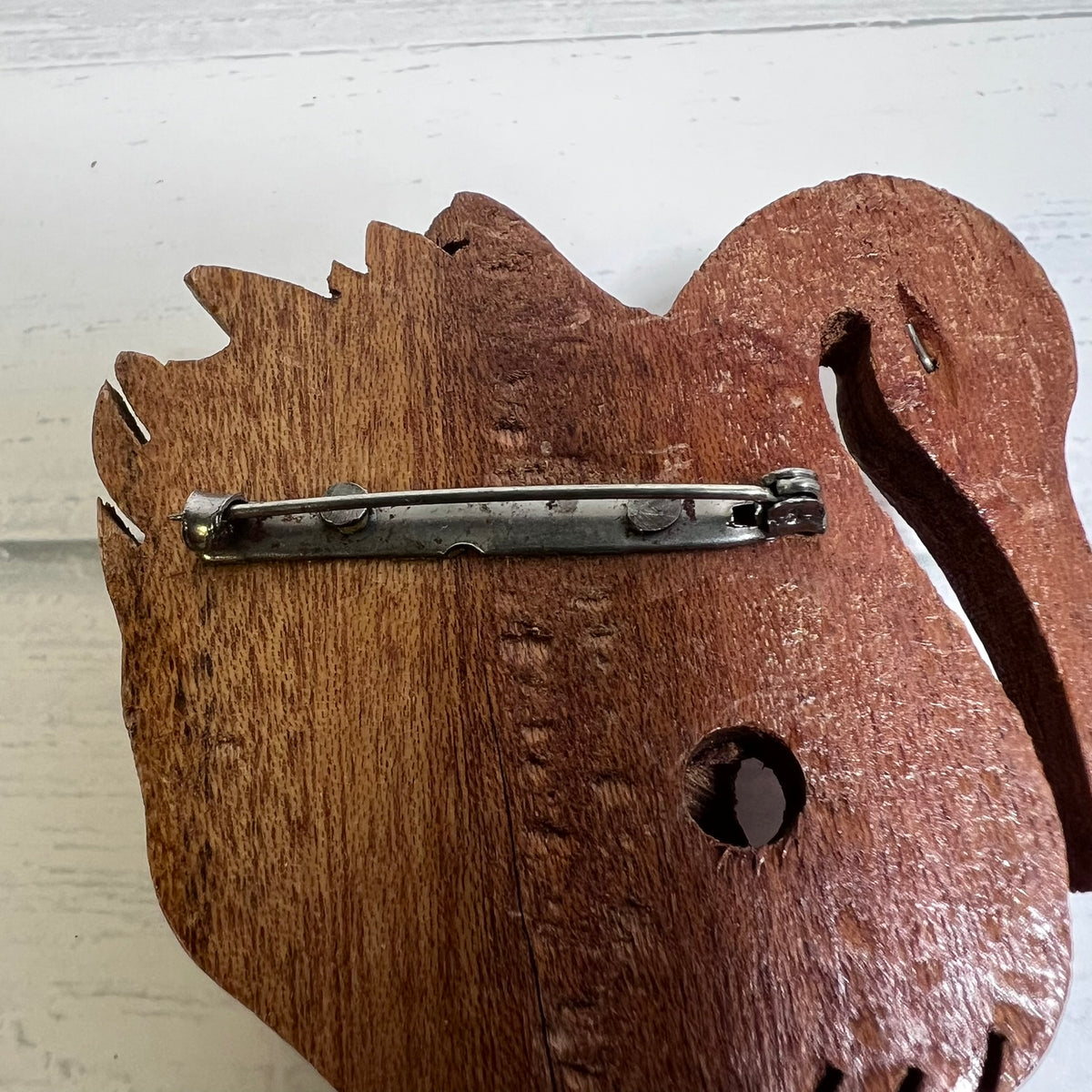 Vintage hand-carved wooden flamingo brooch dating to the 1940s
