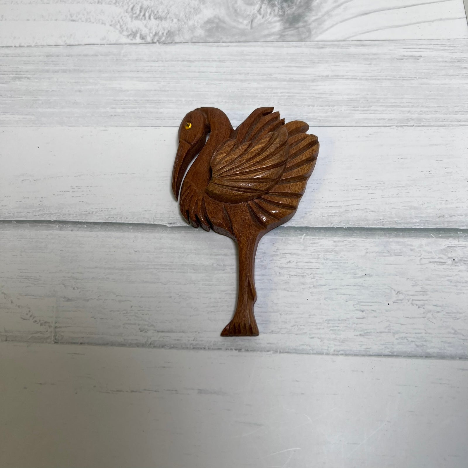 Vintage hand-carved wooden flamingo brooch dating to the 1940s