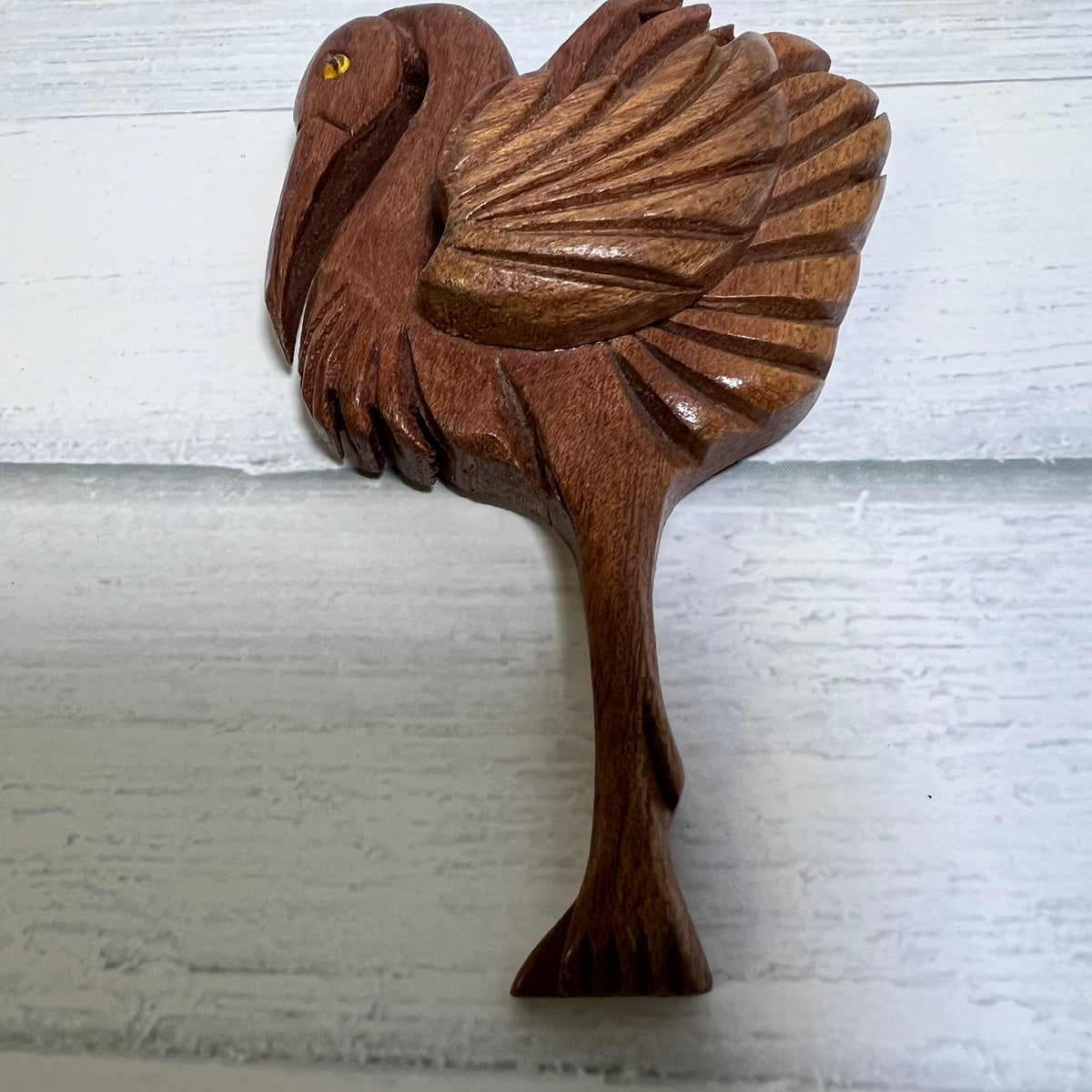 Vintage hand-carved wooden flamingo brooch dating to the 1940s