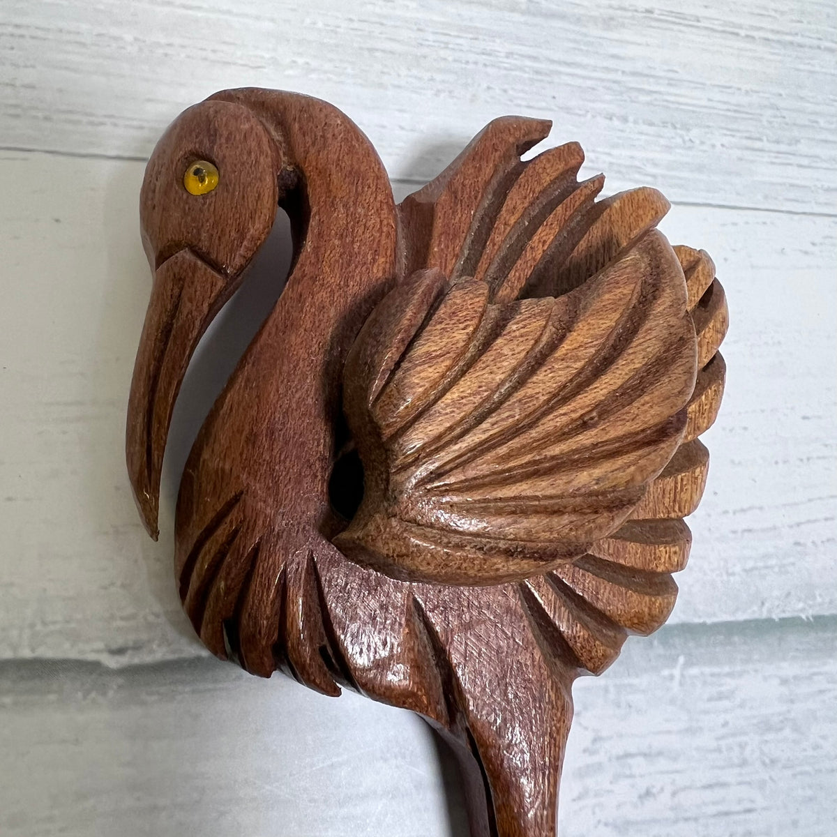 Vintage hand-carved wooden flamingo brooch dating to the 1940s