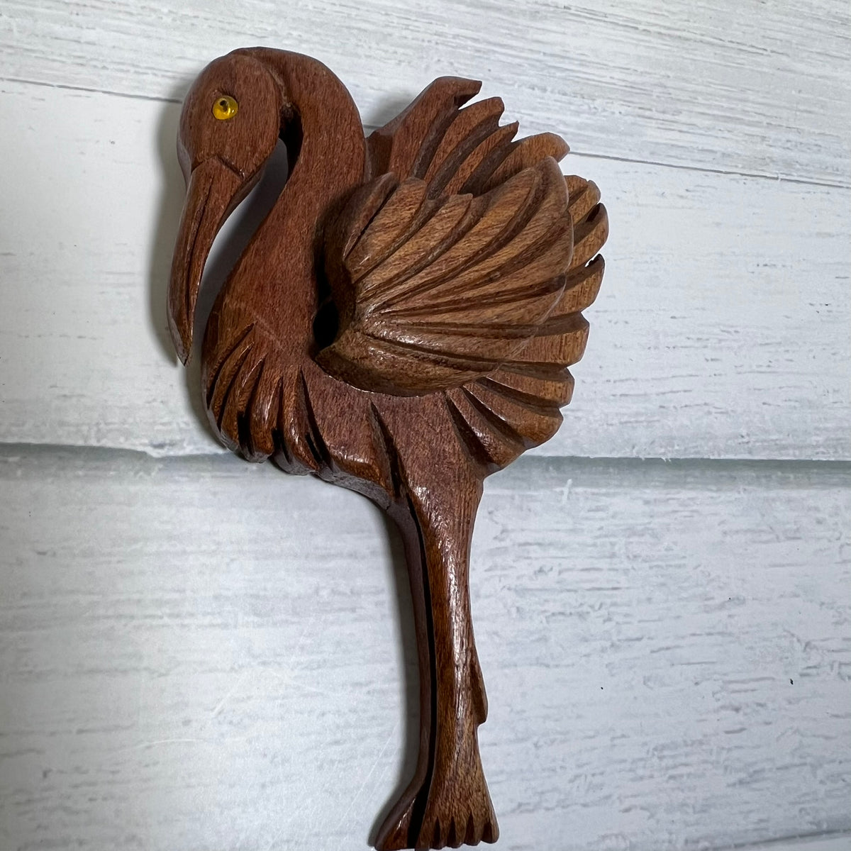 Vintage hand-carved wooden flamingo brooch dating to the 1940s