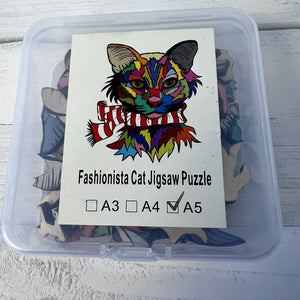 Jigsaw puzzle packaging with a colorful cat illustration and size options.